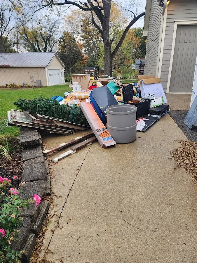 Dumpster being loaded with debris for Commercial Dumpster Rental in South Gate